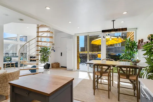 a view of a dining room with furniture window and outside view
