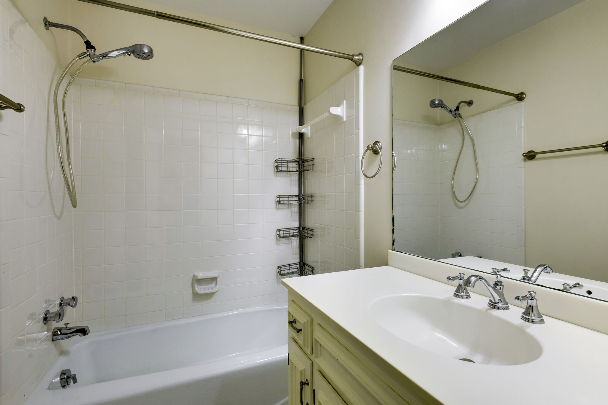 1126 General George Patton Road Nashville, TN 37221 - Photo 18 of 28 a bathroom with a sink a mirror and a shower