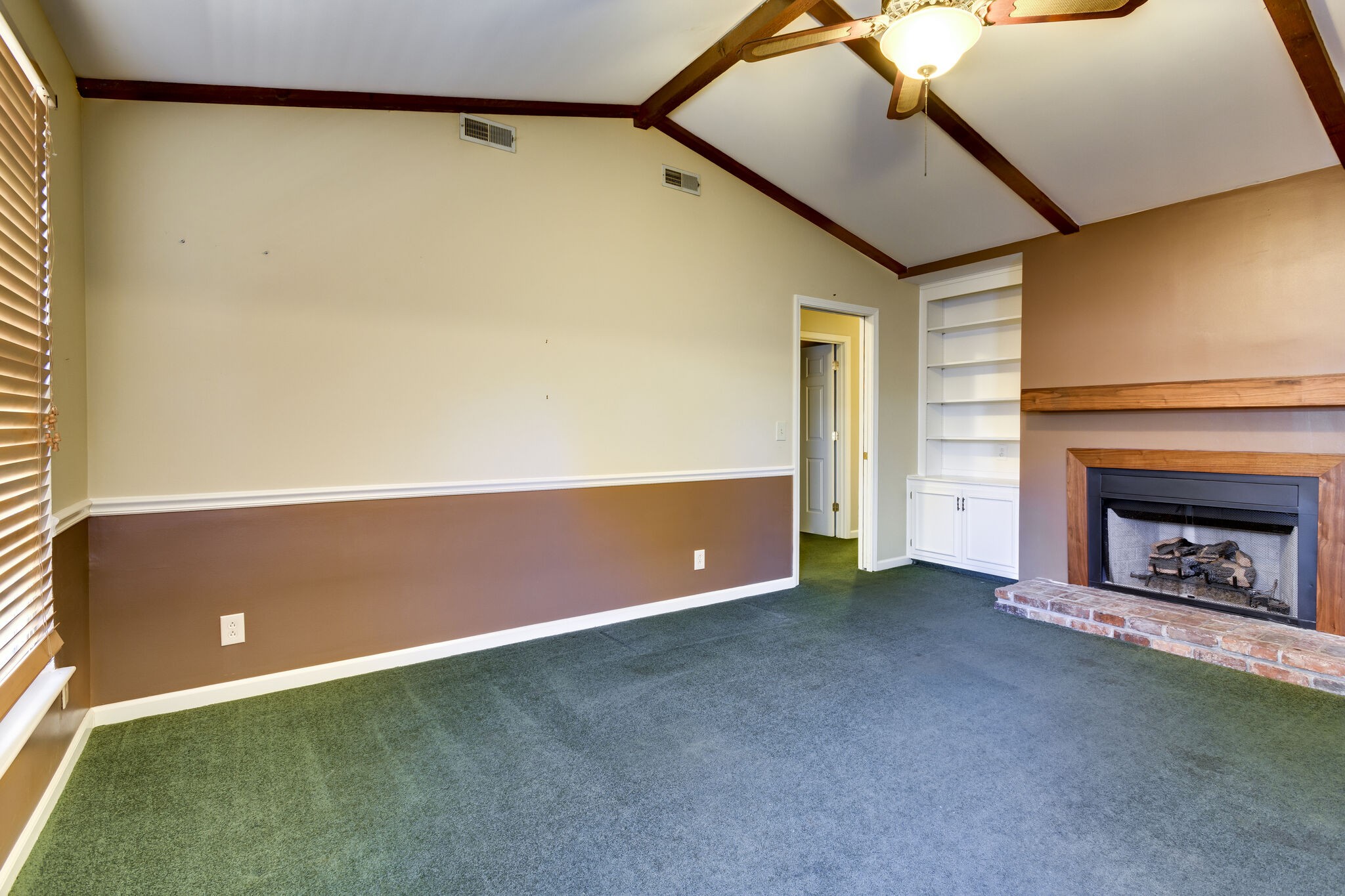 1126 General George Patton Road Nashville, TN 37221 - Photo 10 of 28 a view of an empty room with a fireplace and a window