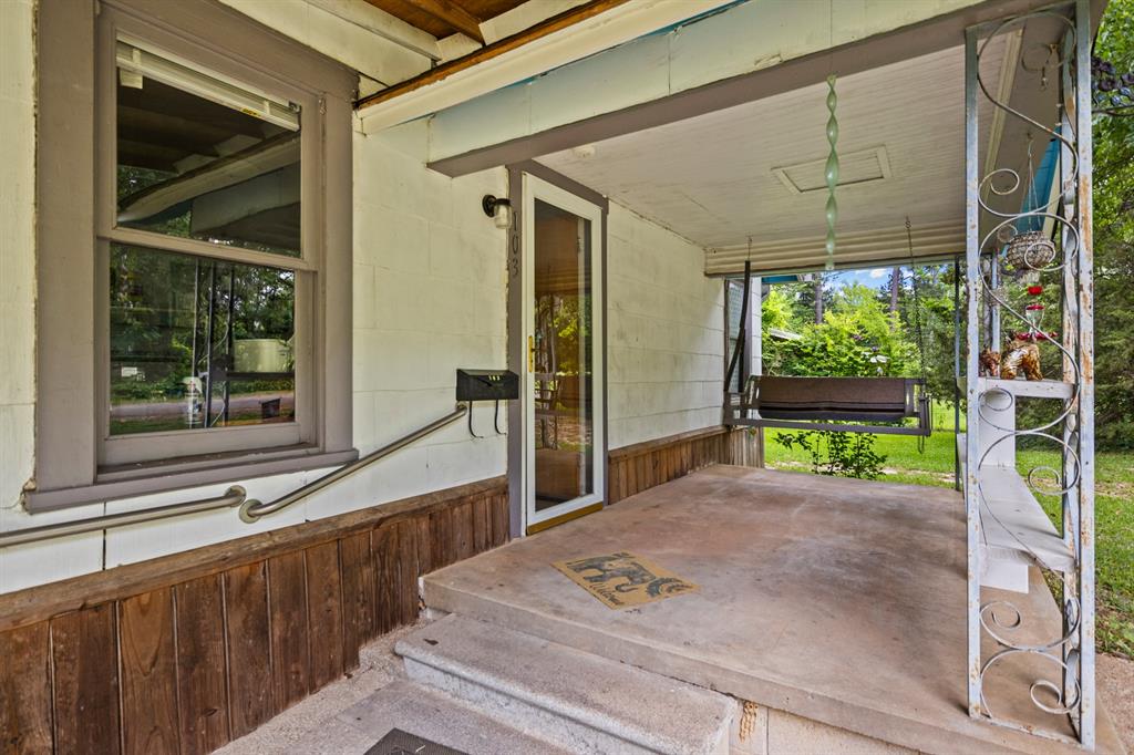 103 South Sun Camp Road White Oak, TX 75693 - Photo 4 of 40 a porch with seating area