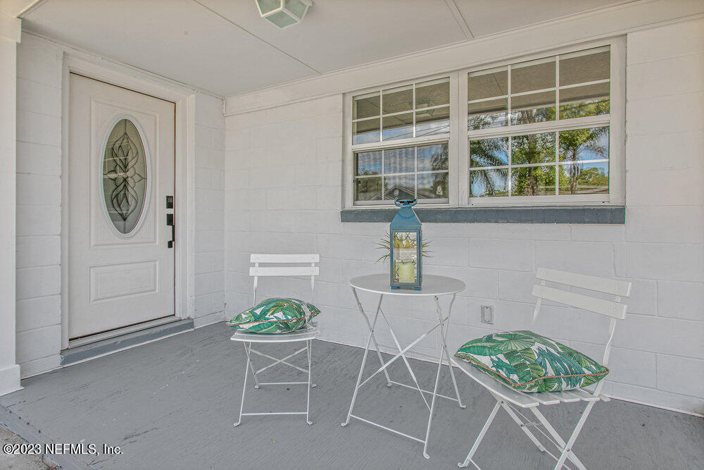 7036 Camelot Road Jacksonville, FL 32211 - Photo 3 of 27 a dining room with a table and chairs