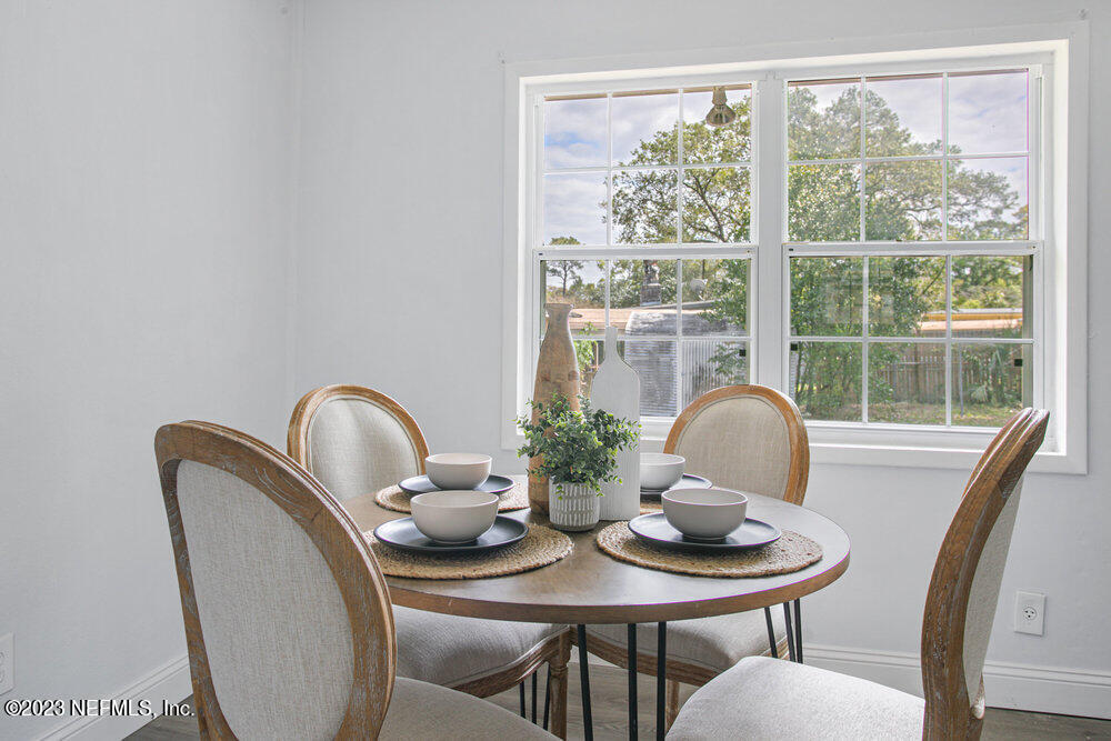 7036 Camelot Road Jacksonville, FL 32211 - Photo 8 of 27 a view of a dining room with furniture window and outside view