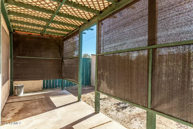 a balcony view with a glass door