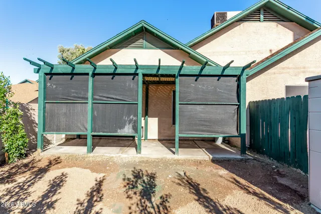 a backyard of a house with seating space
