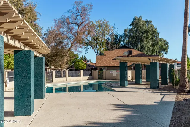 a view of a park with large trees