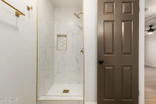 a bathroom with a glass shower door