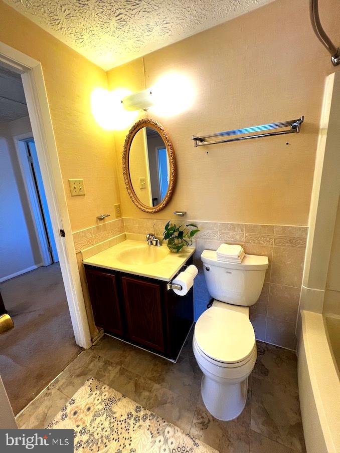 8318 Brookvale Court Springfield, VA 22153 - Photo 11 of 21 a bathroom with a sink mirror vanity and toilet