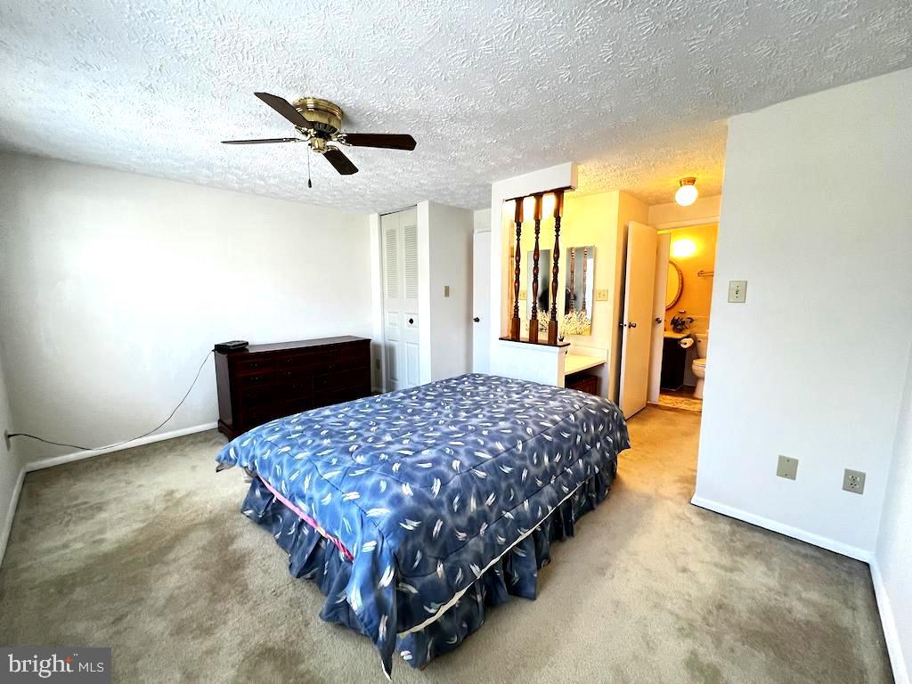 8318 Brookvale Court Springfield, VA 22153 - Photo 13 of 21 a bedroom with a bed and window