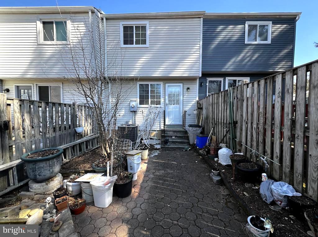 8318 Brookvale Court Springfield, VA 22153 - Photo 18 of 21 a view of a patio with table and chairs and barbeque grill