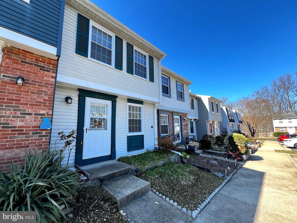 8318 Brookvale Court Springfield, VA 22153 - Photo 2 of 21 a front view of a house with garden