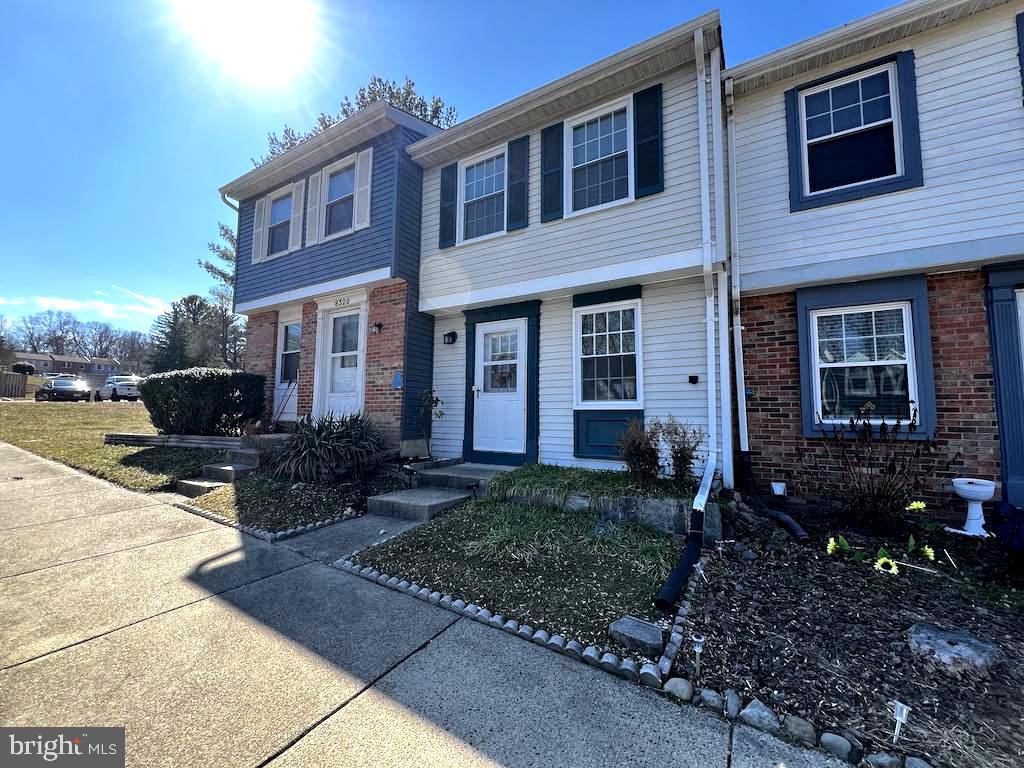 8318 Brookvale Court Springfield, VA 22153 - Photo 4 of 21 a front view of a house with garden