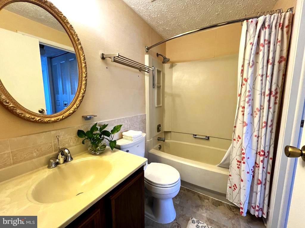 8318 Brookvale Court Springfield, VA 22153 - Photo 10 of 21 a bathroom with a sink toilet and shower