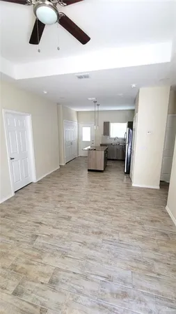 a view of a livingroom with furniture nad wooden floor