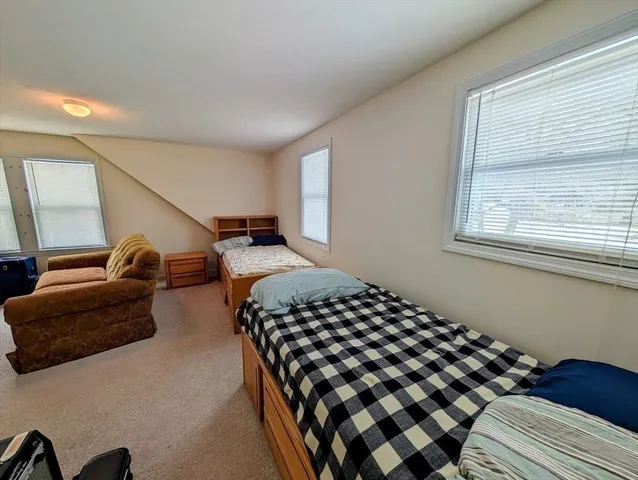a view of room with furniture and window