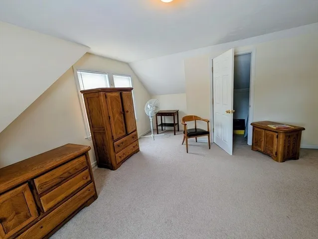 a bathroom with a sink a toilet a shower curtain and a mirror