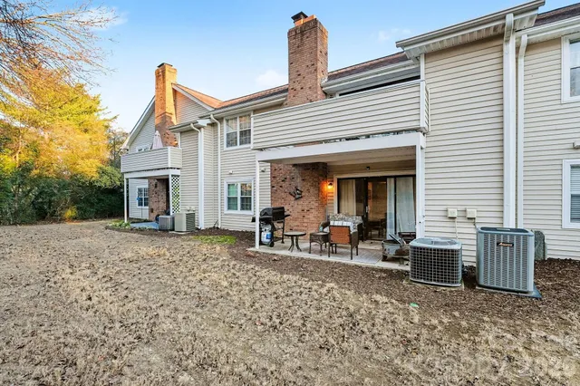 a view of a house with backyard sitting area and porch