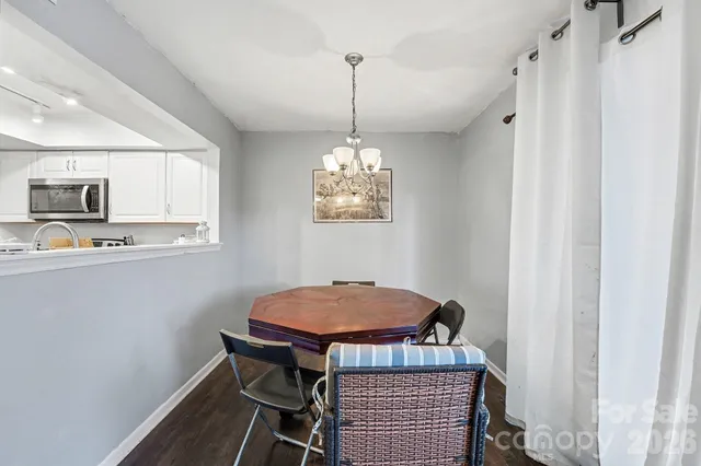 a dining room with a table and chairs