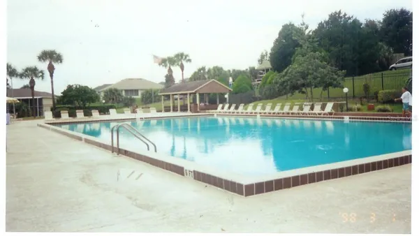 a view of a swimming pool with a lake view