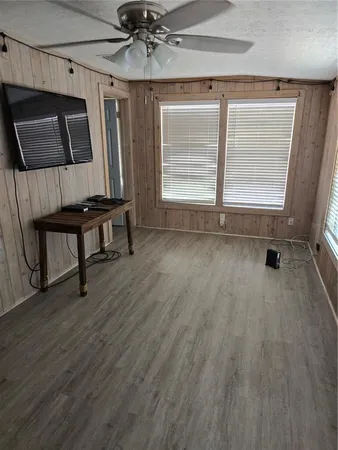 a view of room with window and wooden floor