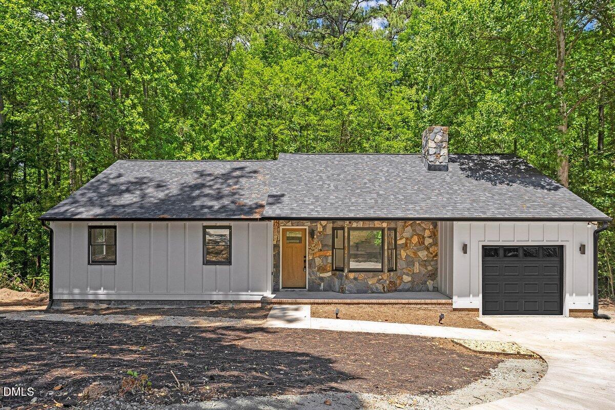 1712 Rosedale Avenue Durham, NC 27707 - Photo 1 of 39 a front view of a house with a yard and garage