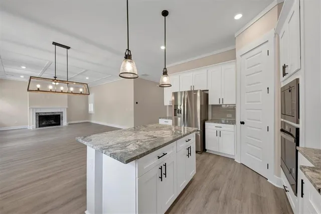 a stove top oven sitting inside of a kitchen
