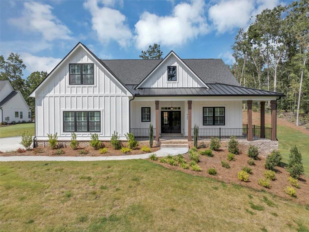 960 Oxford Road Ball Ground, GA 30107 - Photo 2 of 54 a front view of a house with outdoor seating
