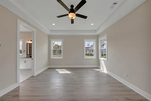 a spacious bathroom with a bathtub sink and mirror