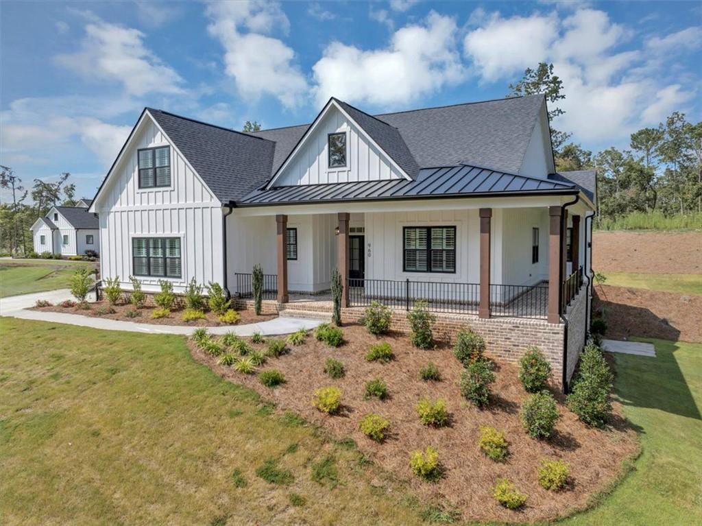 960 Oxford Road Ball Ground, GA 30107 - Photo 3 of 54 a front view of a house with garden