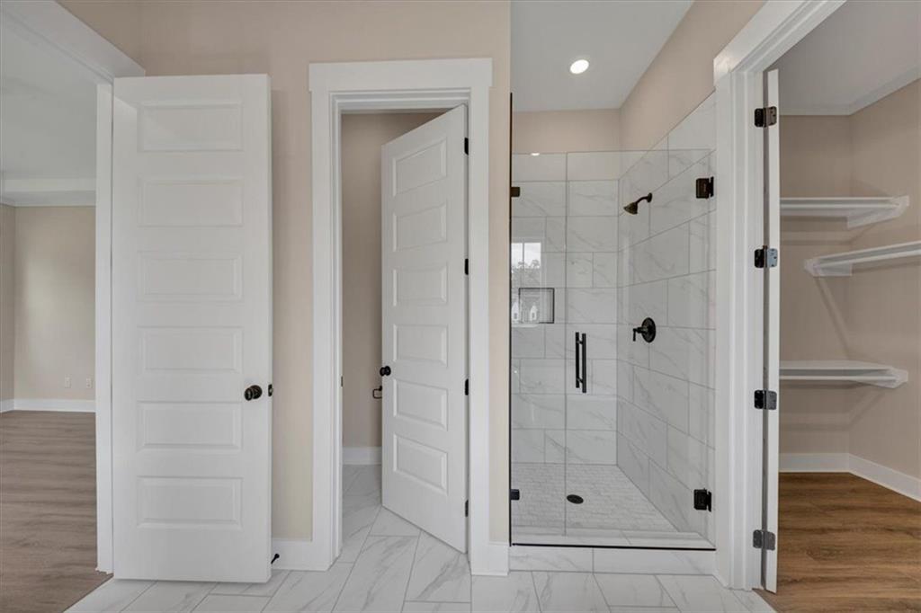 960 Oxford Road Ball Ground, GA 30107 - Photo 32 of 54 a bathroom with a shower and sink