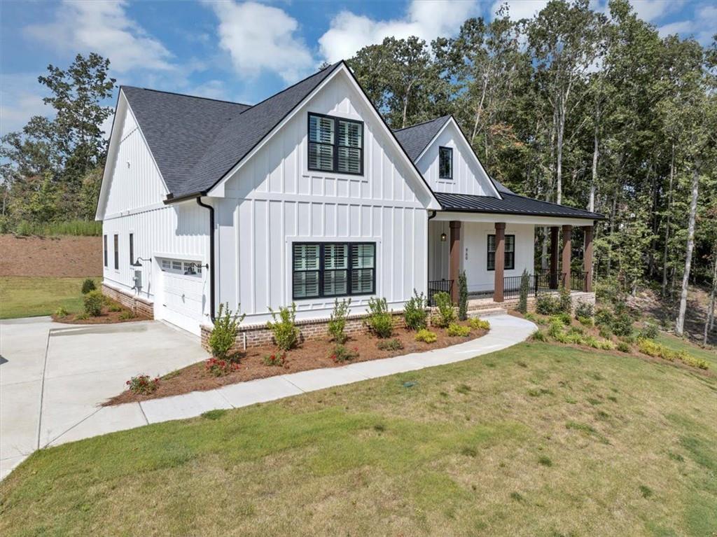 960 Oxford Road Ball Ground, GA 30107 - Photo 4 of 54 a front view of a house with garden