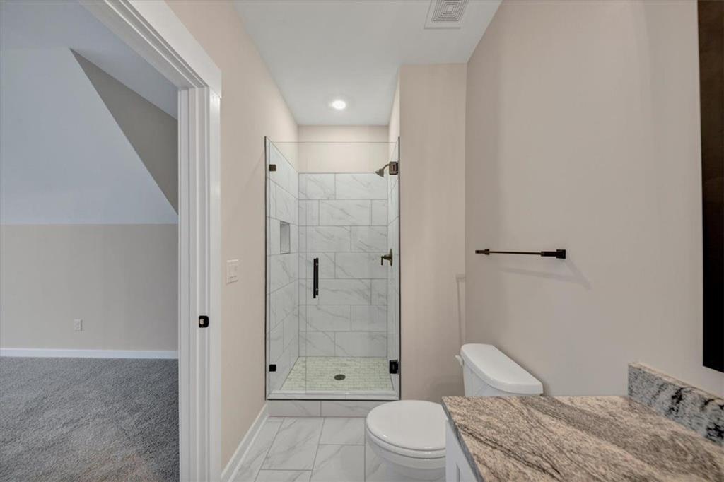 960 Oxford Road Ball Ground, GA 30107 - Photo 41 of 54 a bathroom with a sink toilet and shower