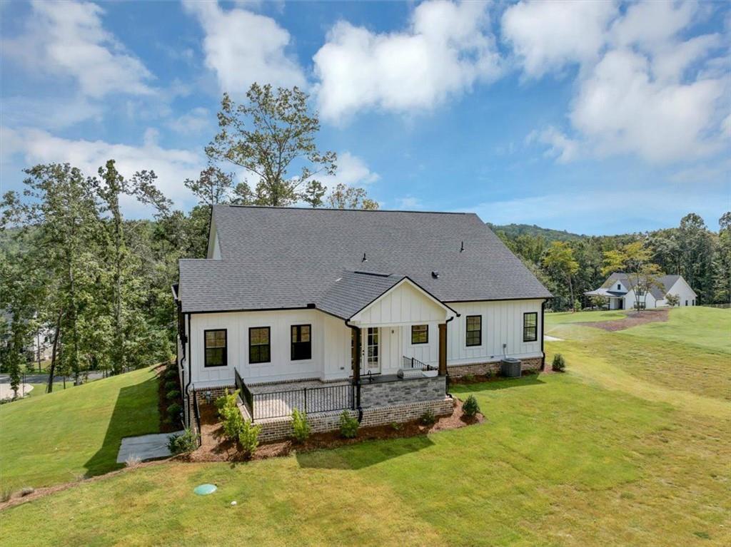960 Oxford Road Ball Ground, GA 30107 - Photo 48 of 54 a aerial view of a house next to a yard