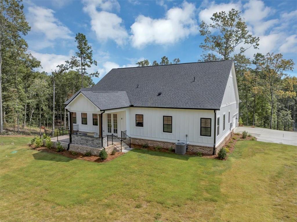 960 Oxford Road Ball Ground, GA 30107 - Photo 49 of 54 front view of house with a yard