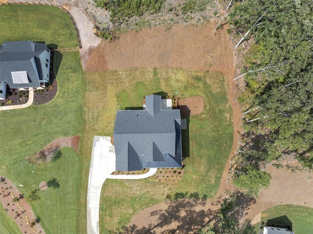960 Oxford Road Ball Ground, GA 30107 - Photo 53 of 54 aerial view of a house with a yard