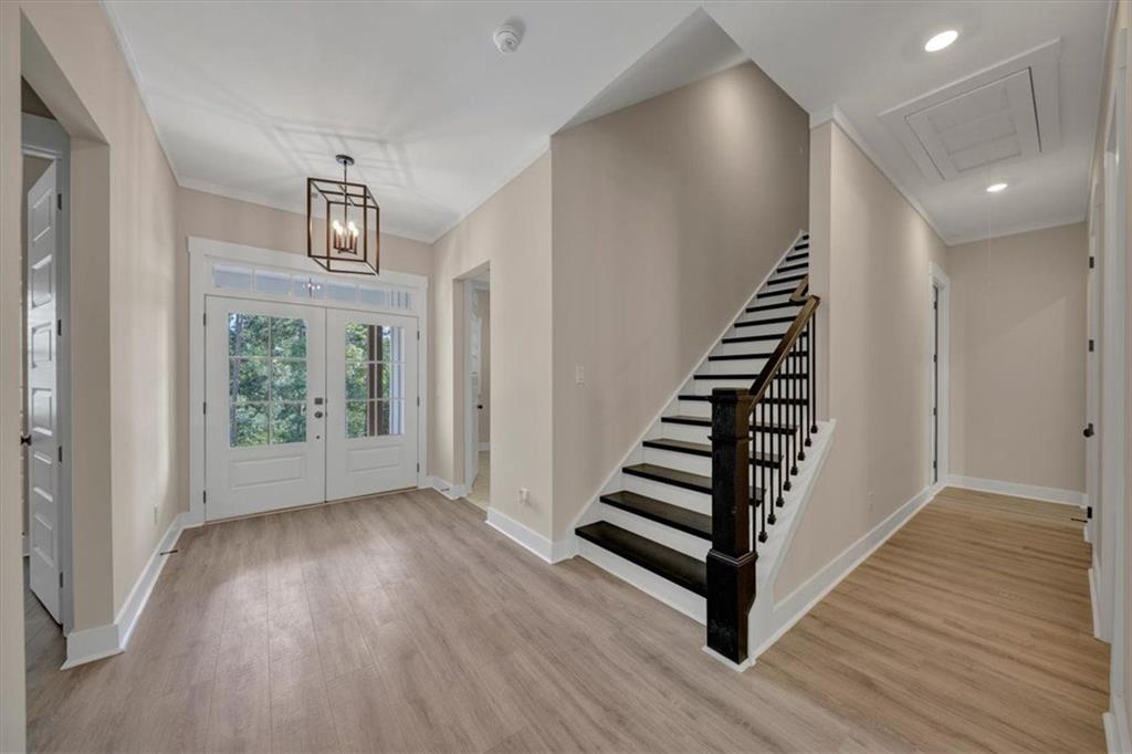 960 Oxford Road Ball Ground, GA 30107 - Photo 9 of 54 a view of entryway and hall with wooden floor