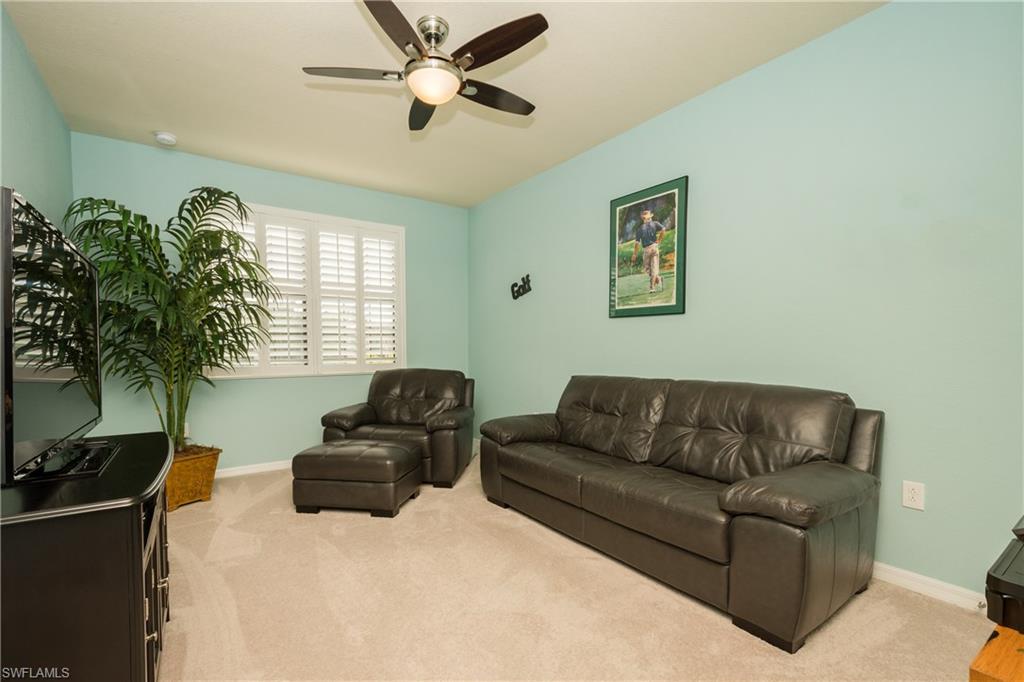 9511 Napoli Lane, Unit 202 Naples, FL 34113 - Photo 14 of 24 a living room with furniture