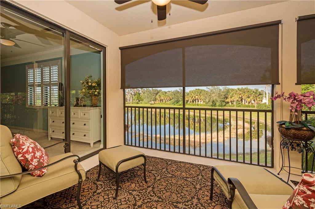 9511 Napoli Lane, Unit 202 Naples, FL 34113 - Photo 19 of 24 a balcony with table and chairs