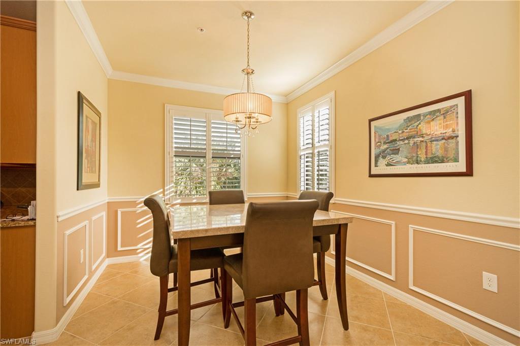 9511 Napoli Lane, Unit 202 Naples, FL 34113 - Photo 5 of 24 a view of a dining room with furniture window and outside view