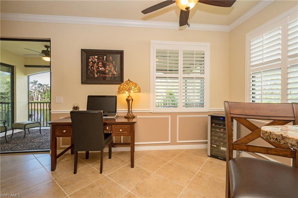 9511 Napoli Lane, Unit 202 Naples, FL 34113 - Photo 8 of 24 a view of a workspace with furniture and a window