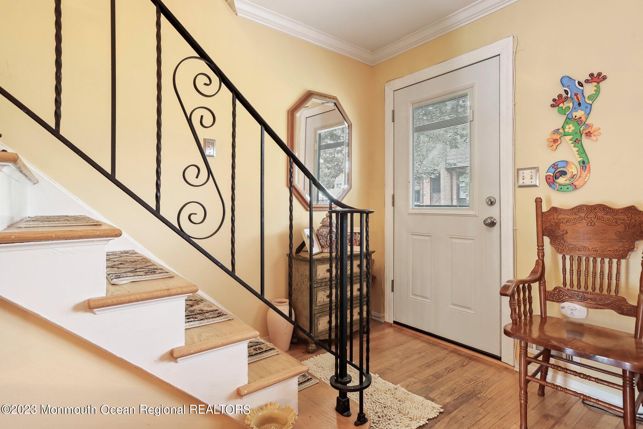 301 Spring Street, Unit 1 Red Bank, NJ 07701 - Photo 4 of 23 a view of entryway and hall with wooden floor
