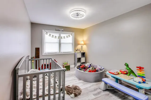 a room with toys and book shelf