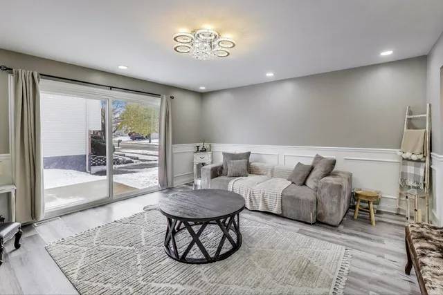a living room with furniture and a rug