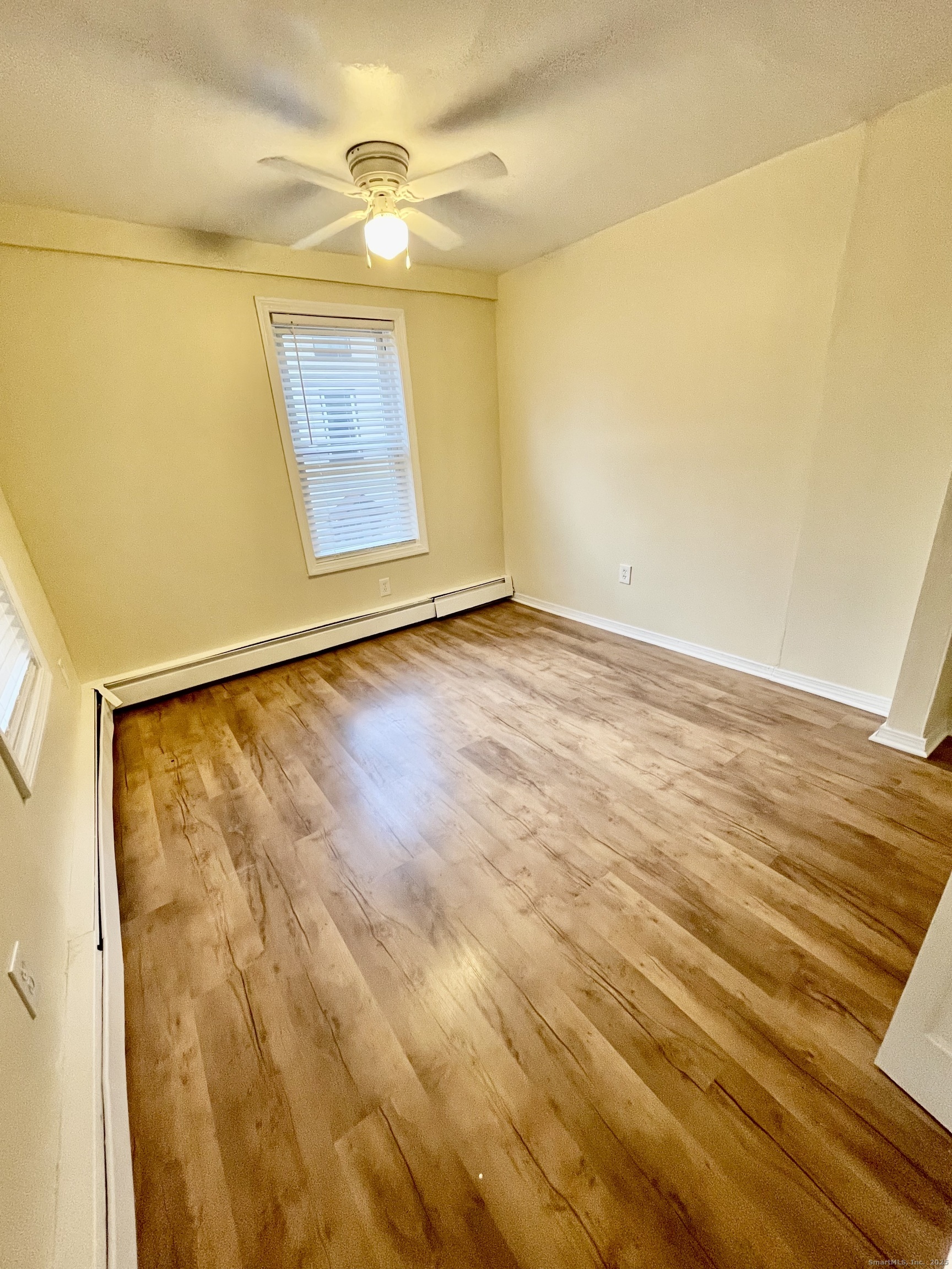92 West Main Street, Unit 3 Vernon, CT 06066 - Photo 9 of 13 a view of an empty room and window