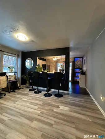 a view of a livingroom with furniture and a flat screen tv