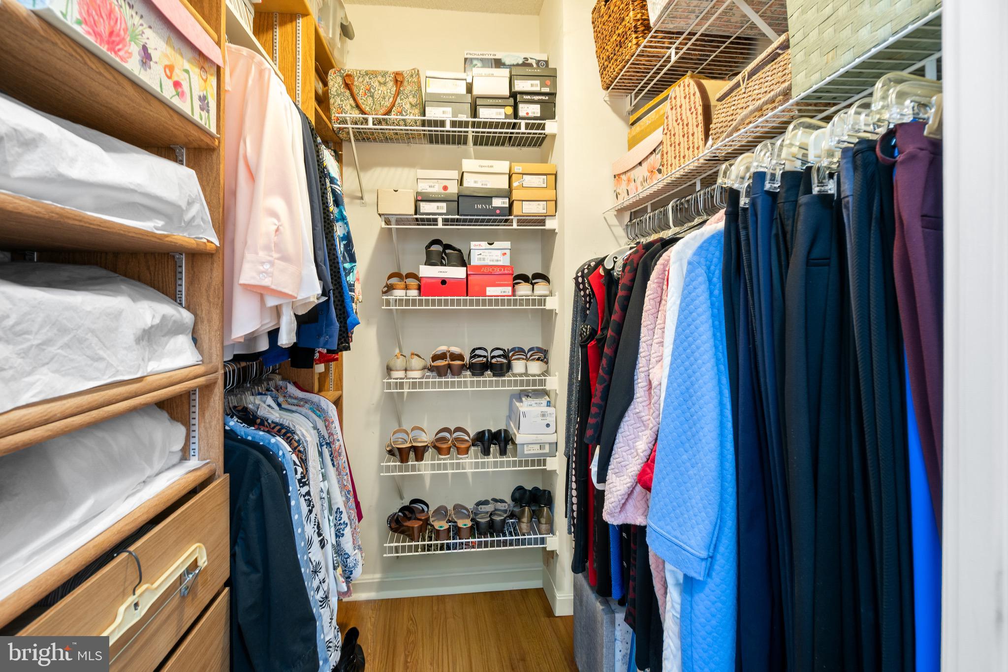 3005 South Leisure World Boulevard, Unit 702 Silver Spring, MD 20906 - Photo 18 of 43 a view of walk in closet with clothes and shoes