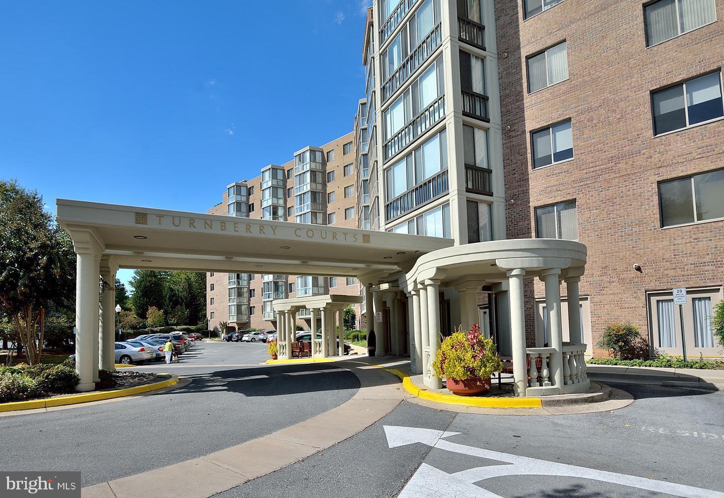3005 South Leisure World Boulevard, Unit 702 Silver Spring, MD 20906 - Photo 29 of 43 a view of tall building with large windows and plants