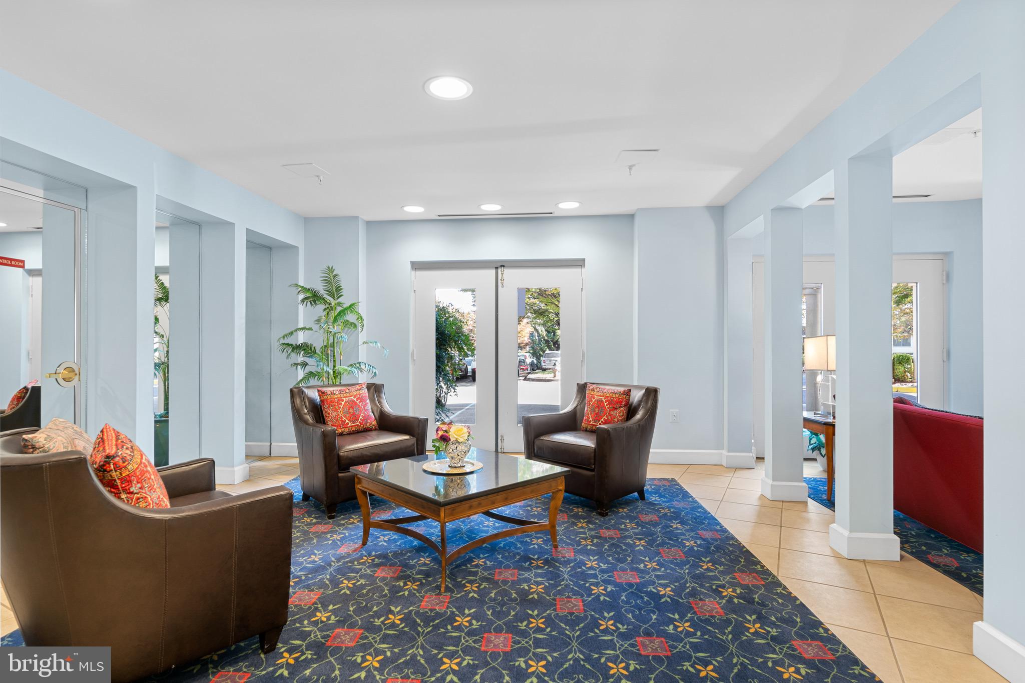 3005 South Leisure World Boulevard, Unit 702 Silver Spring, MD 20906 - Photo 36 of 43 a living room with furniture and a rug