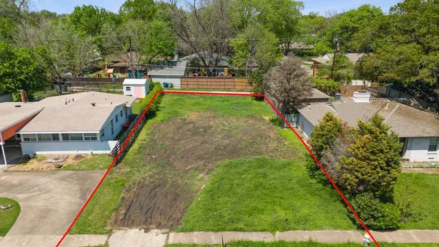 an aerial view of a house with swimming pool garden and patio
