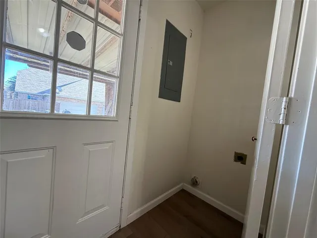 a bathroom with a window and a shower