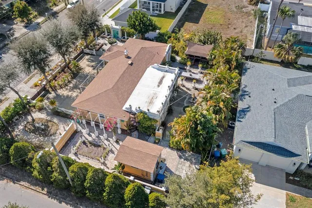 an aerial view of multiple houses with yard